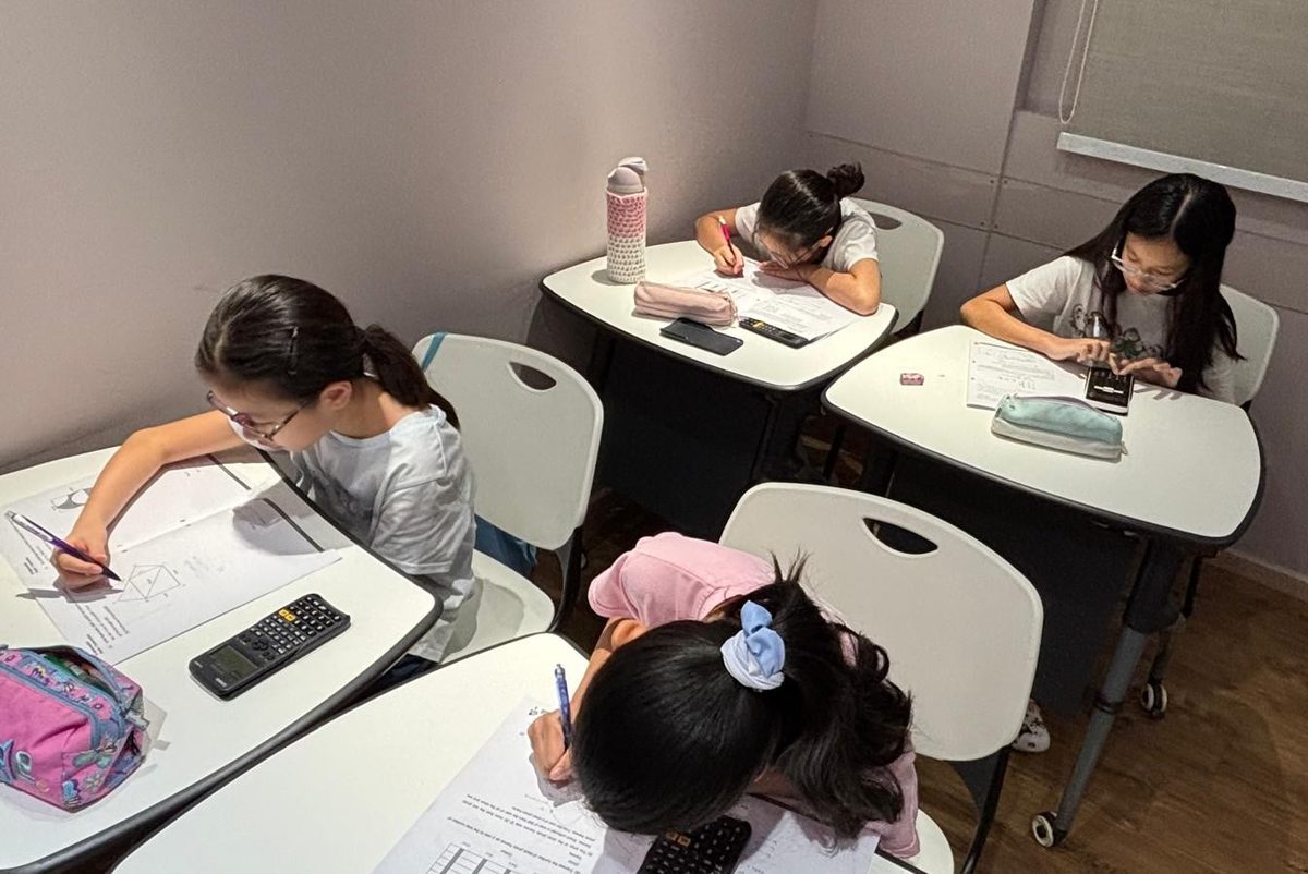 Students working at their desks during a Joyous Learning lesson